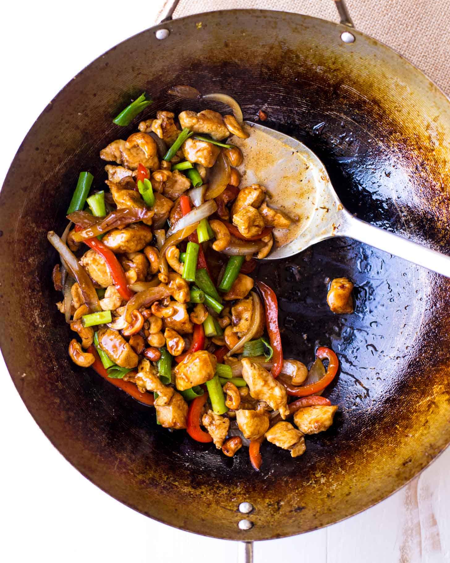 overhead image of stirring Thai Cashew Chicken in a wok