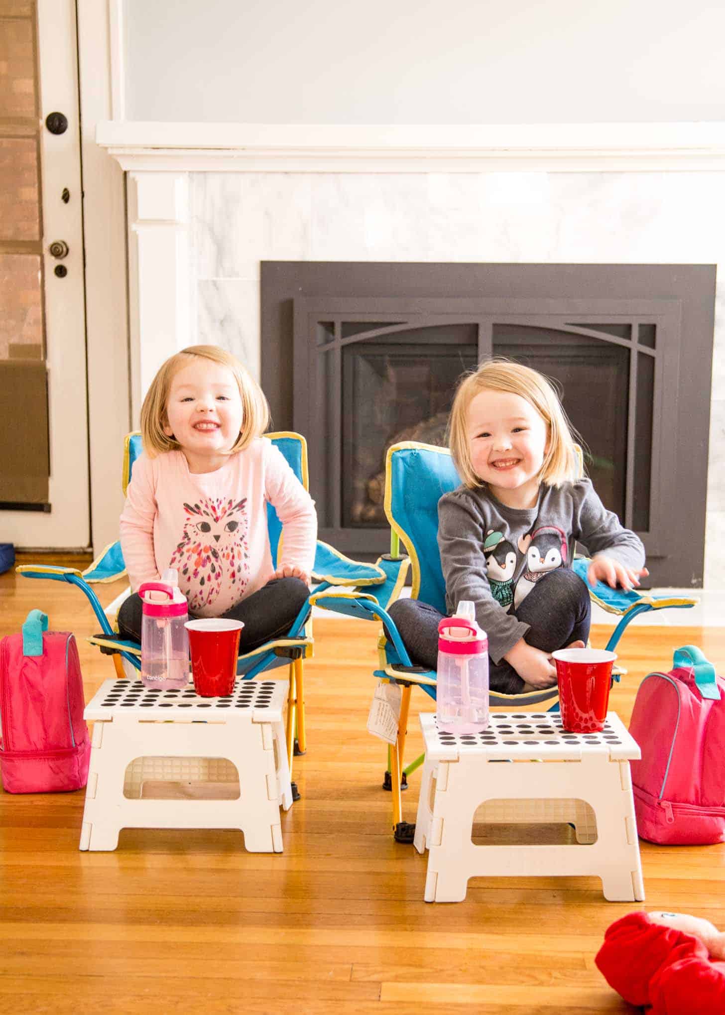 Molly and Clara having a picnic in the living room