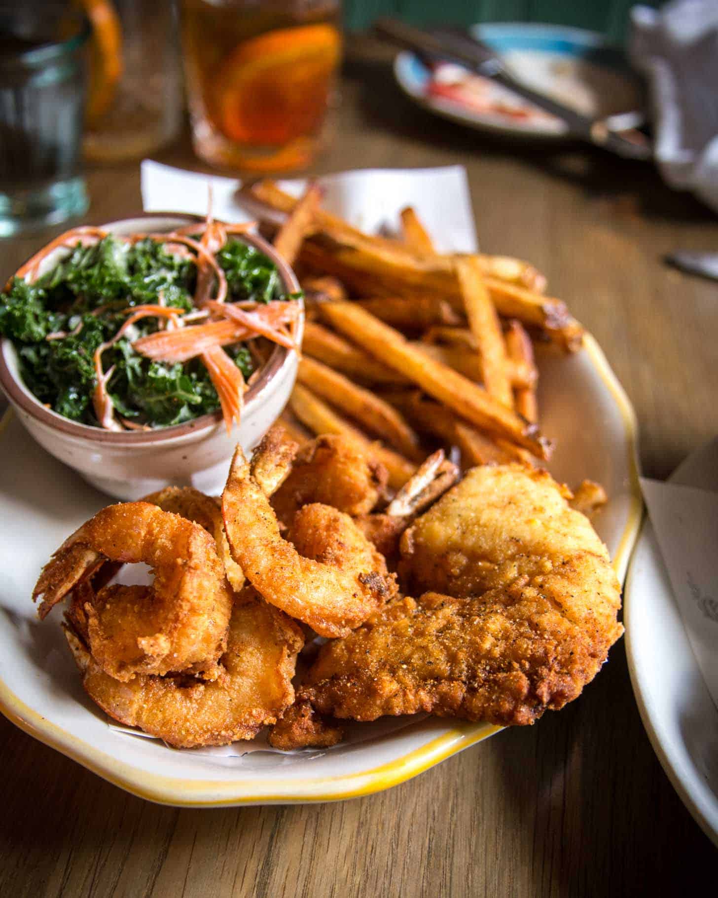 a plate of shrimp and fries