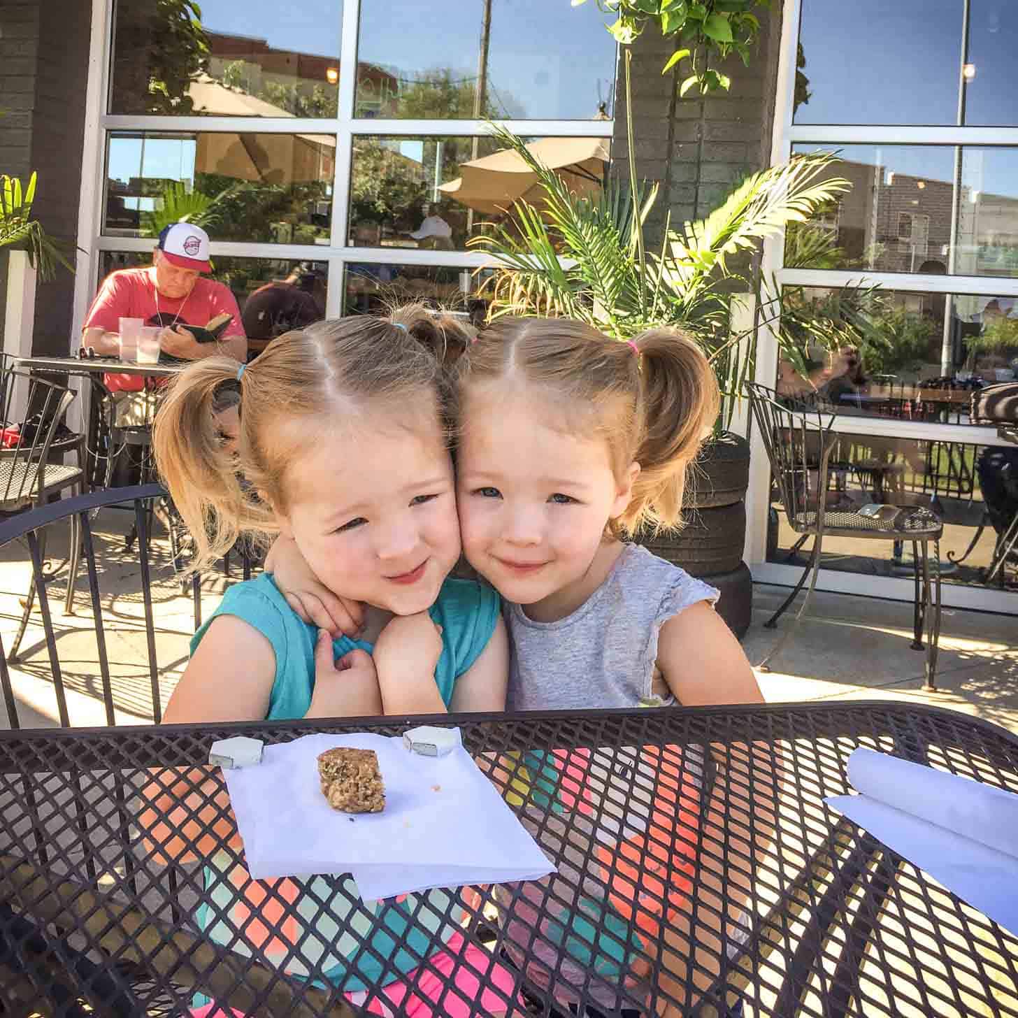 Molly and Clara at a table outside