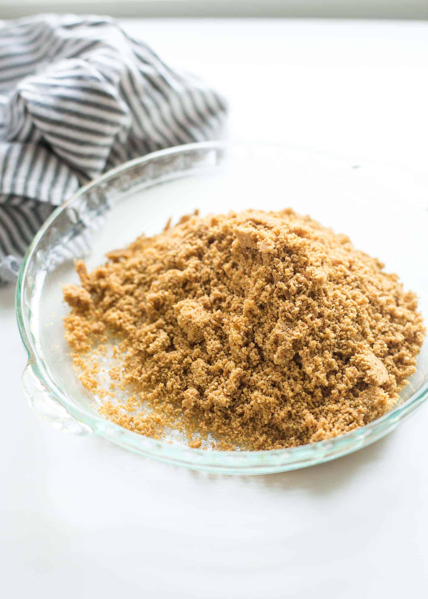 graham cracker crumbs in a clear glass bowl