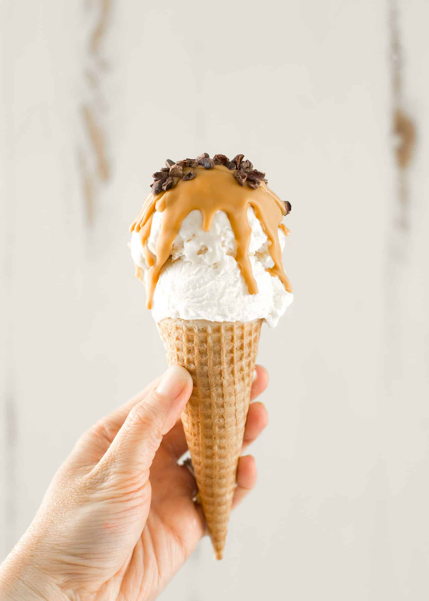 an ice cream cone with butterscotch hard shell