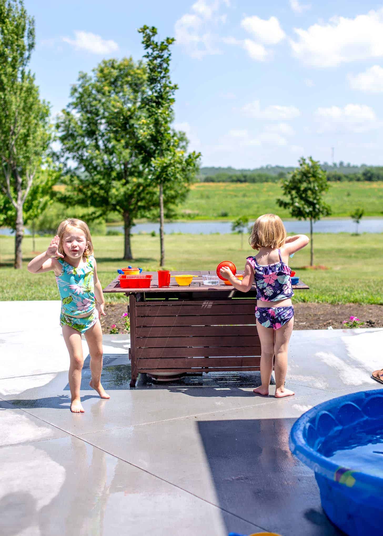 two little girls playing outside