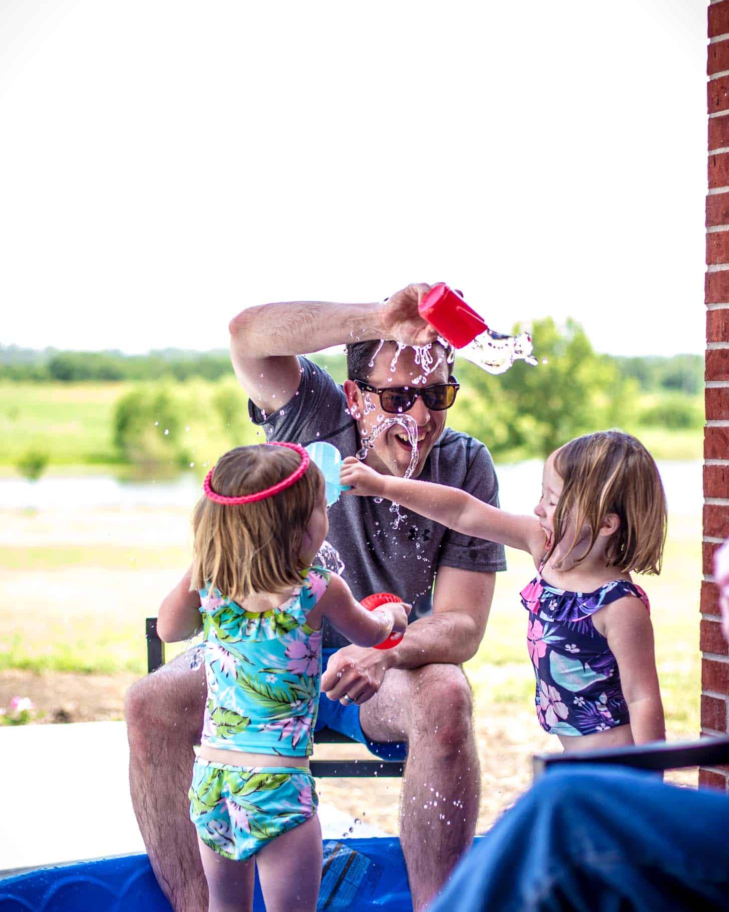 Molly, Clara and Frank playing with water