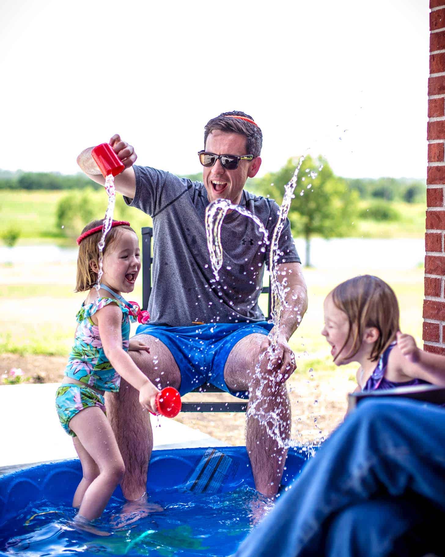 Molly, Clara and Frank playing with water