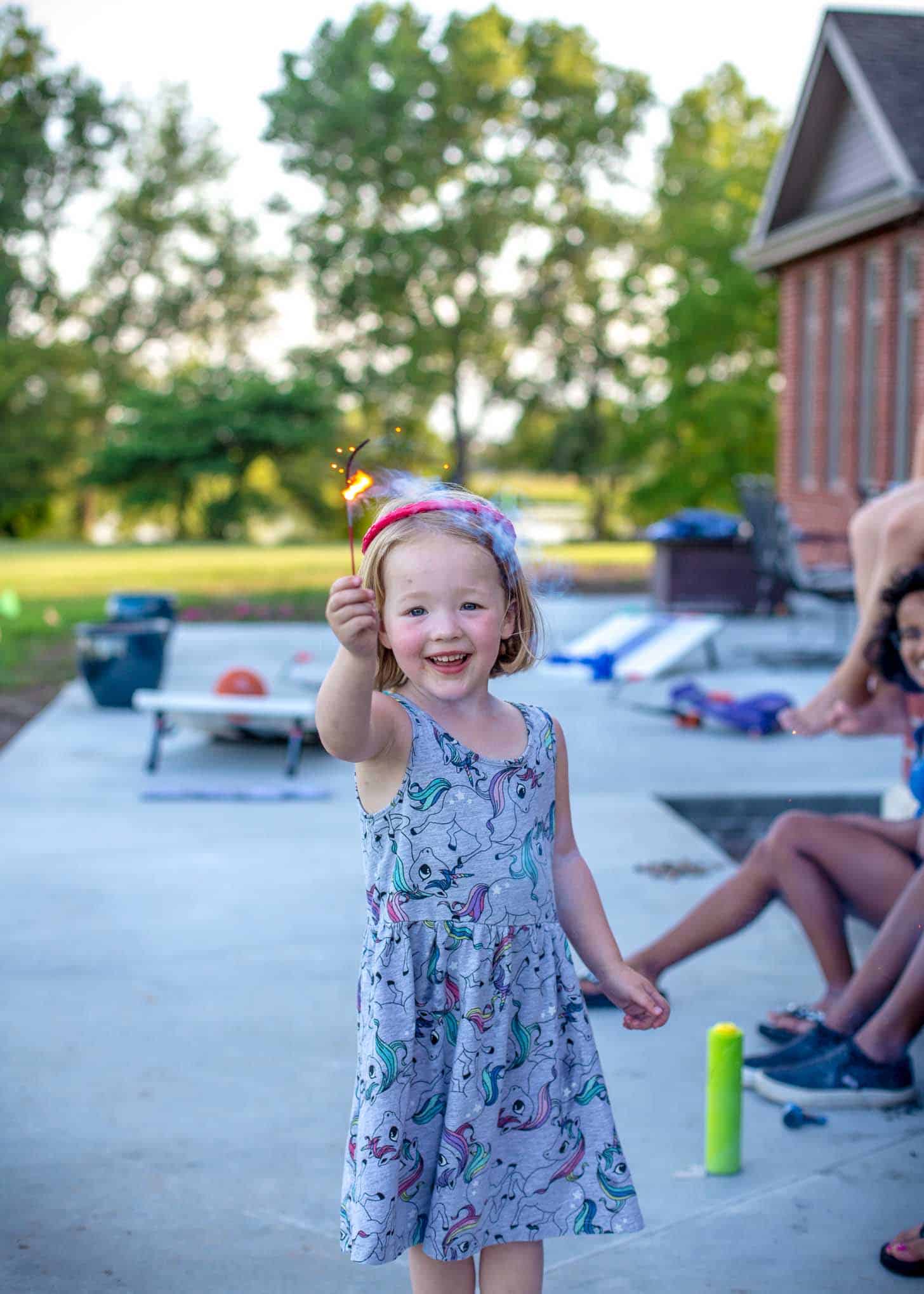 Clara playing with a sparkler