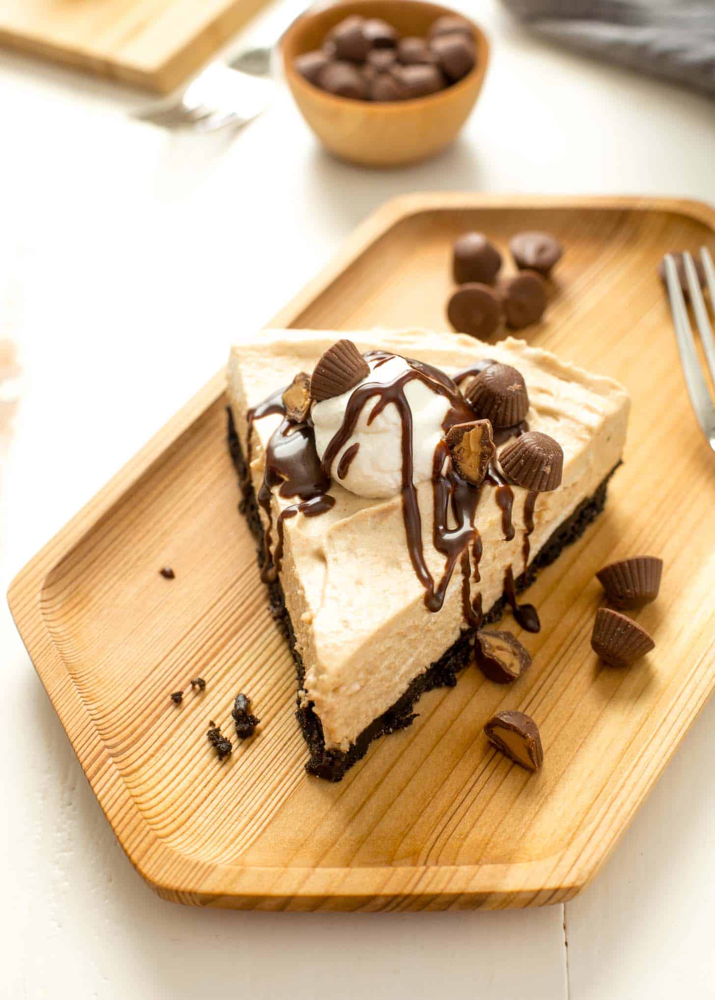 a slice of pie on a wooden tray