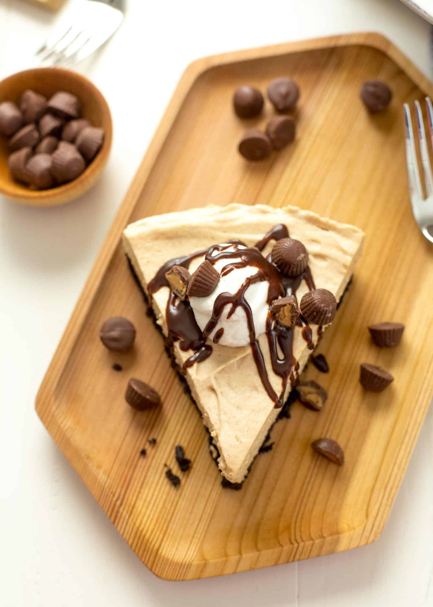 a slice of pie on a wooden tray