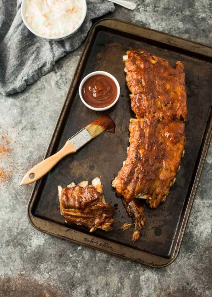 BBQ Ribs and sauce on a sheet pan
