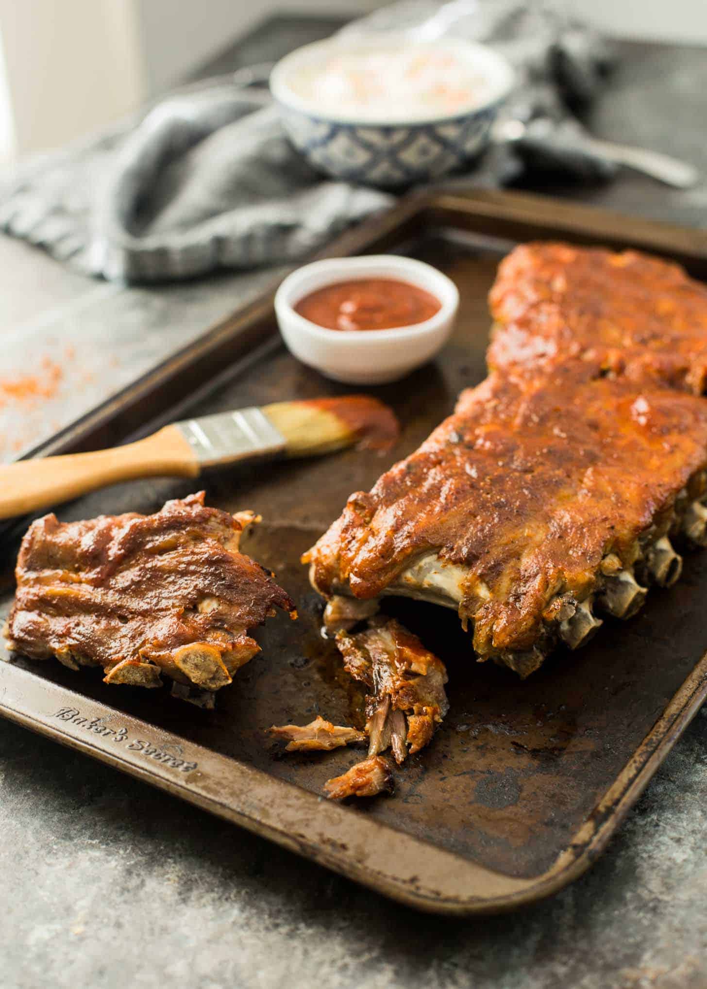 ribs and sauce on a sheet pan