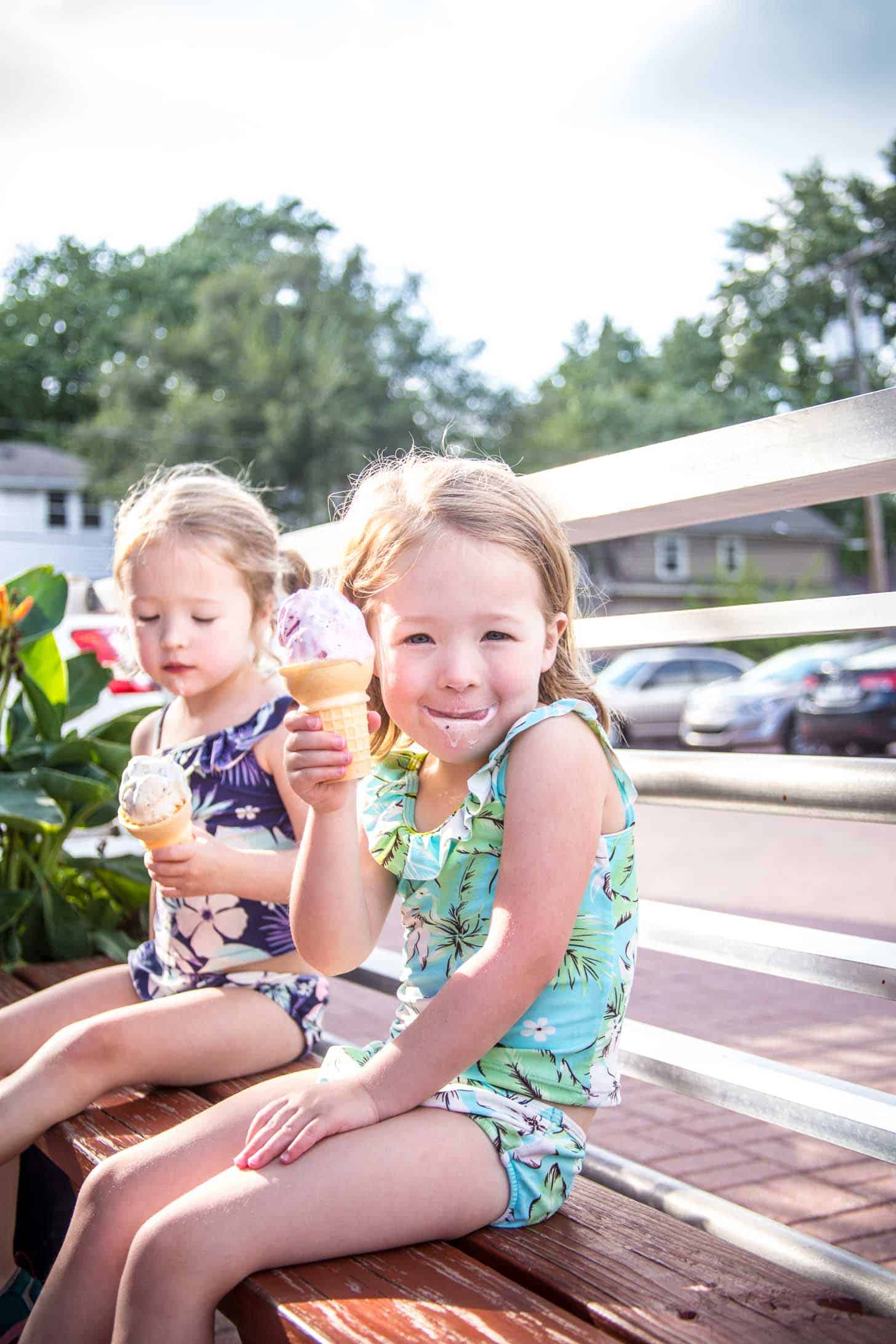 two little girls eating ice cream cones