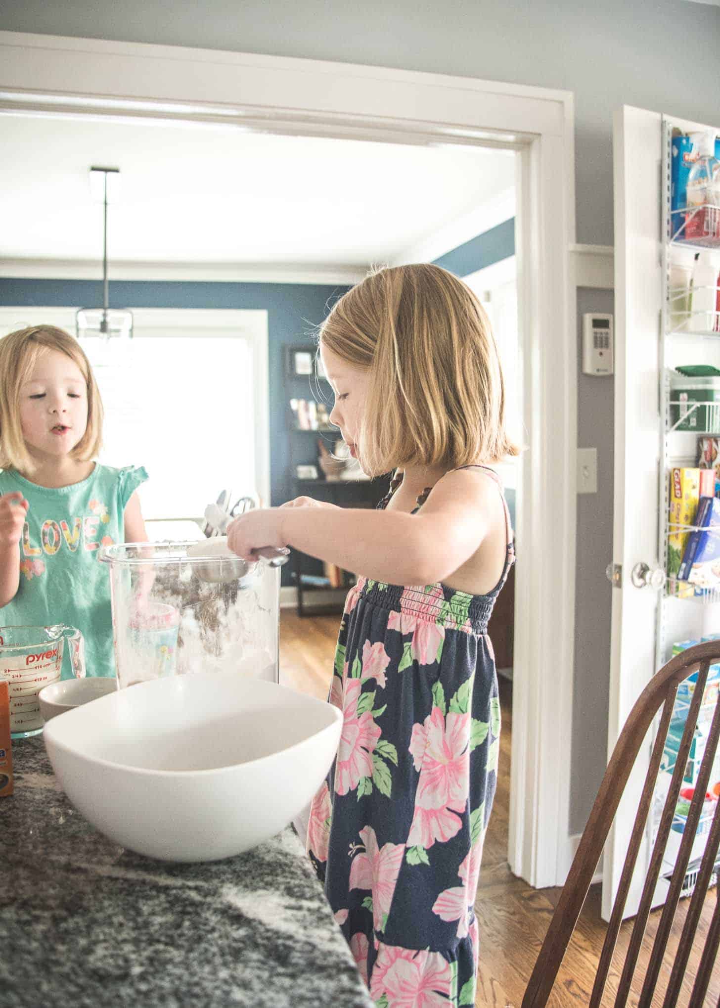 two little girls helping with baking