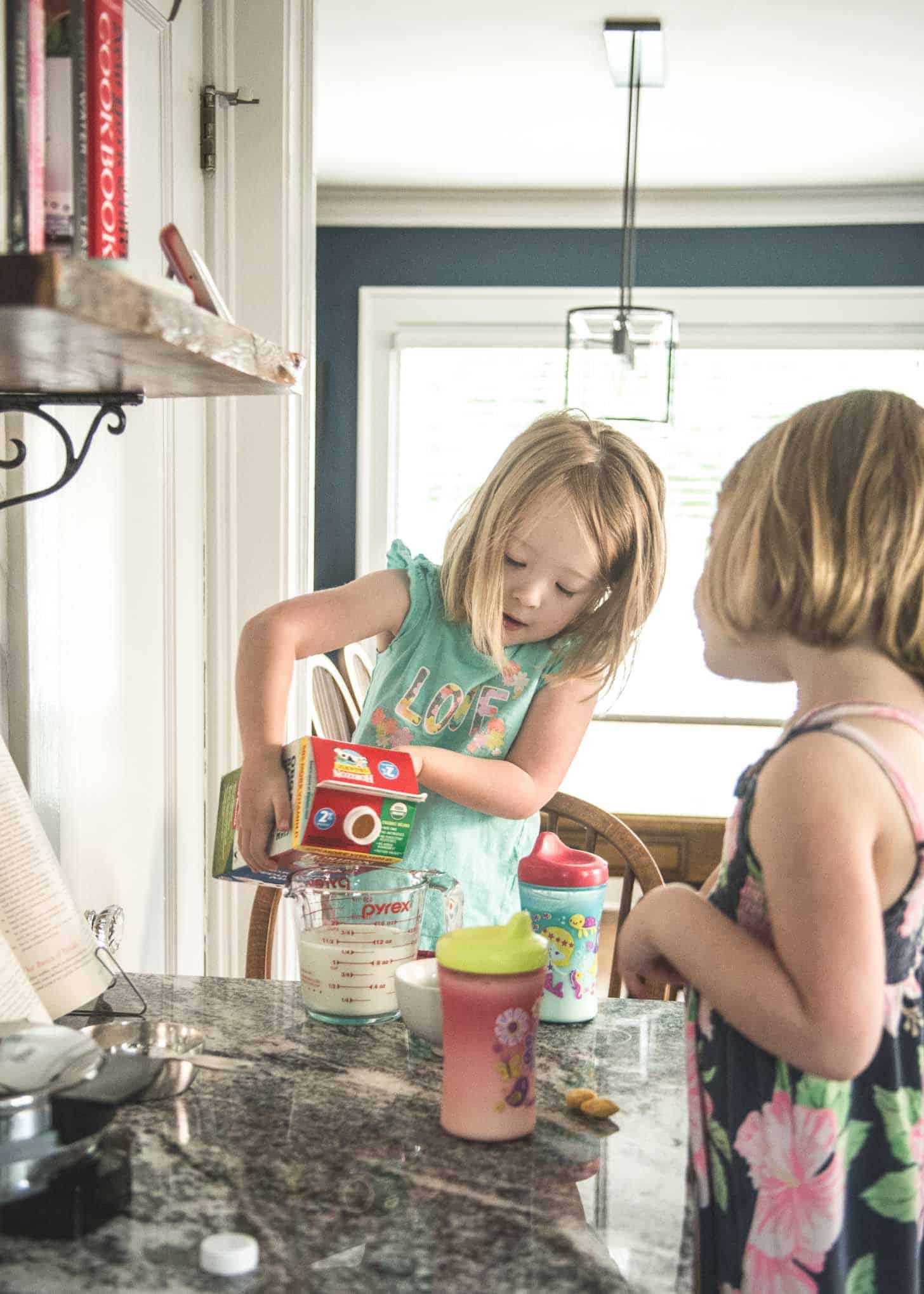 2 little girls helping with baking