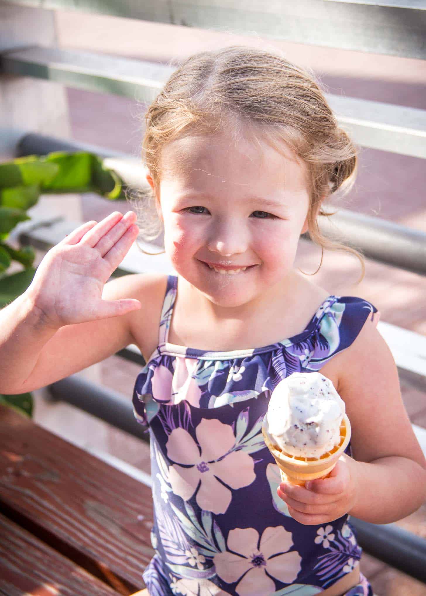   a little girl with an ice cream cone