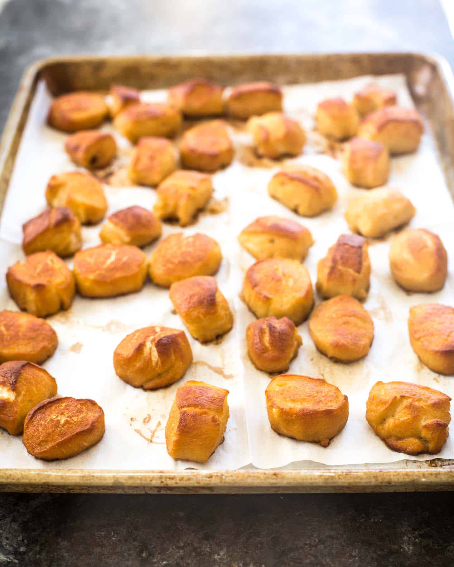 Pumpkin Spice Pretzel Bites on a parchment lined sheet pan