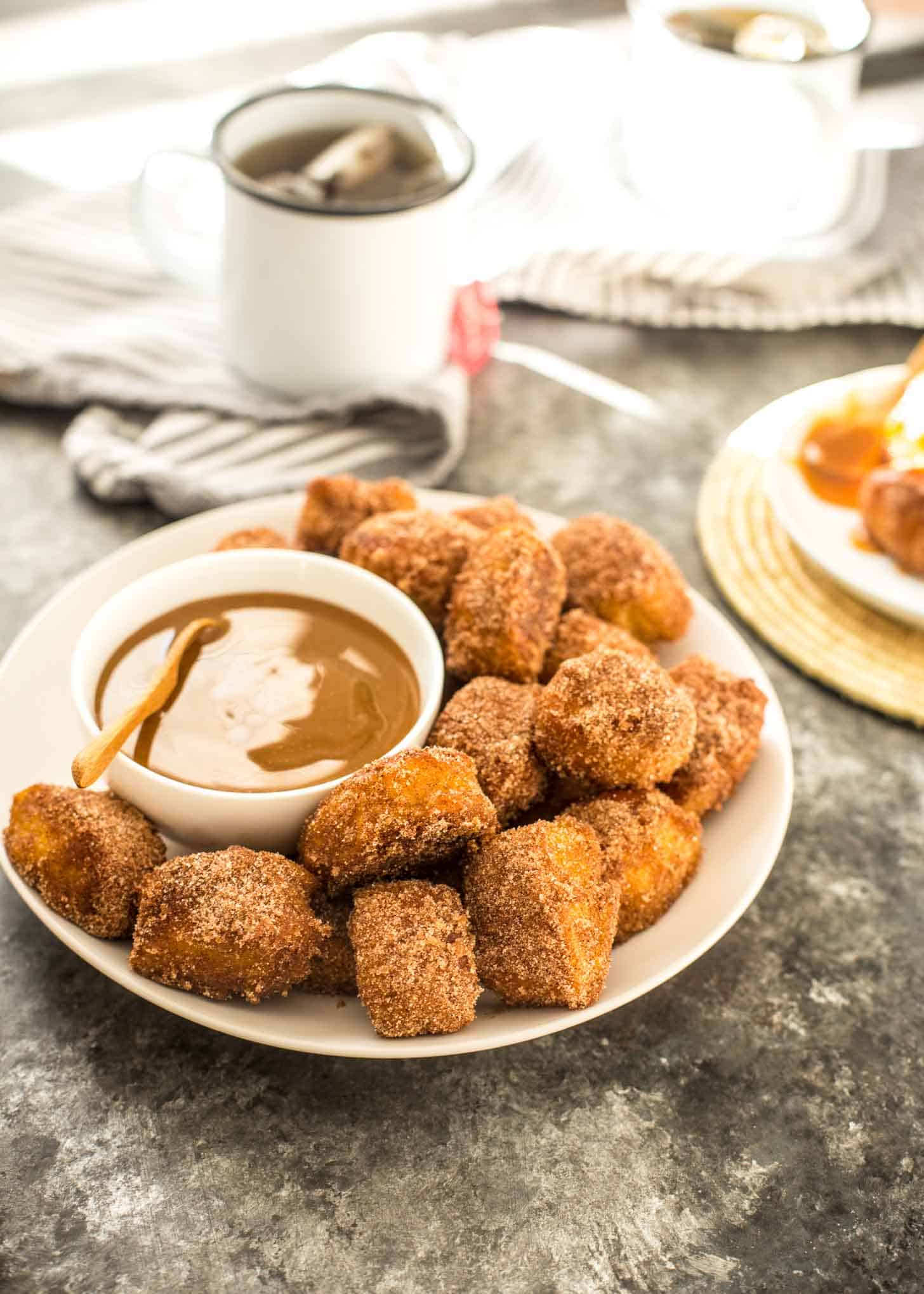  Pretzel Bites on a white plate with dipping sauce