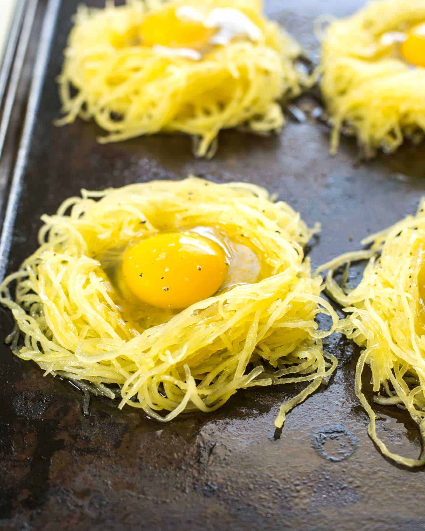 Ready to cook Spaghetti Squash Egg Nests on a sheet pan