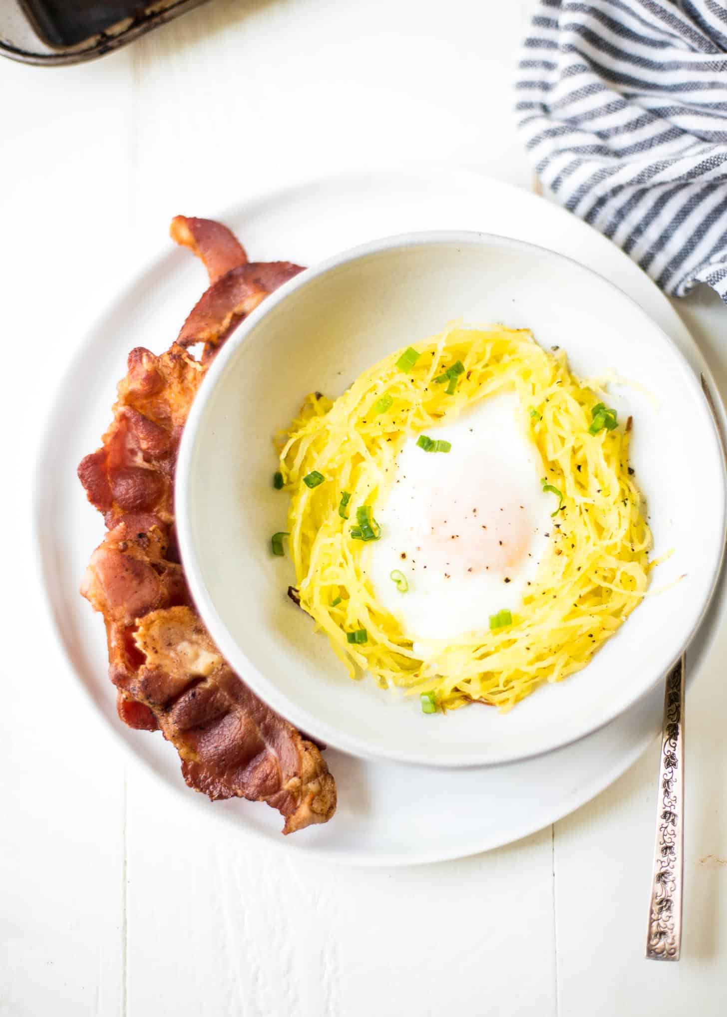 overhead image of Spaghetti Squash Egg Nest in a white bowl