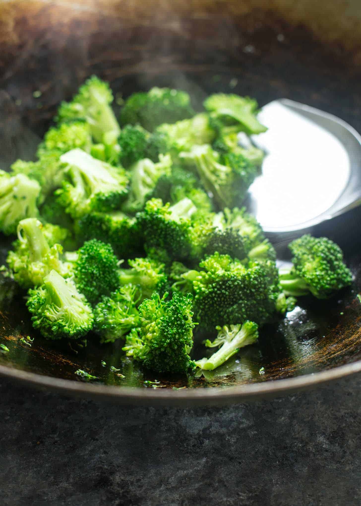 cooking broccoli in a wok