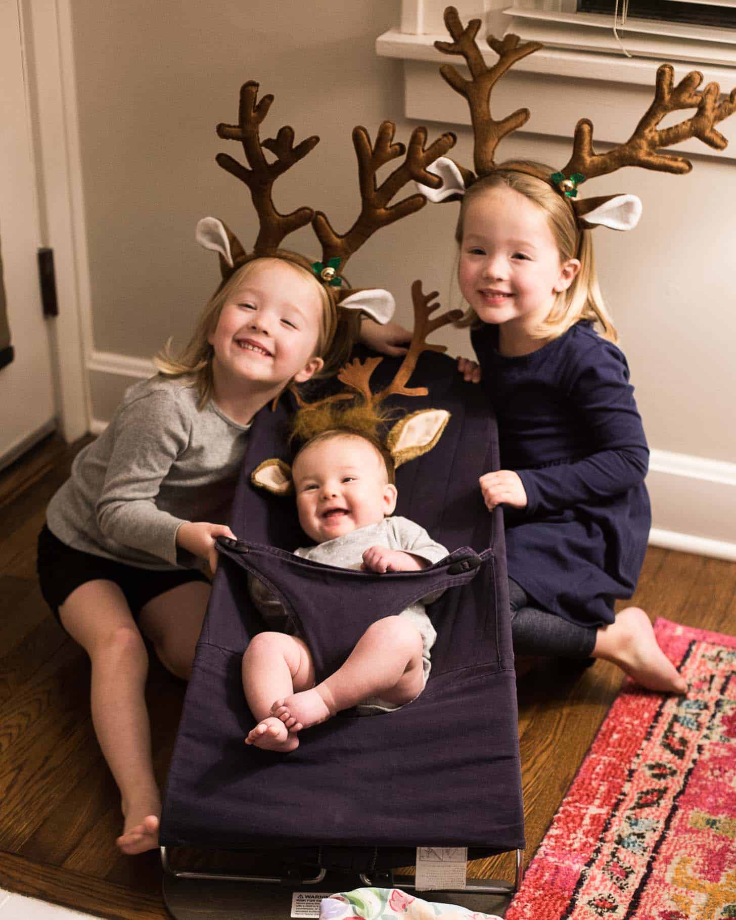 little girls in reindeer antlers