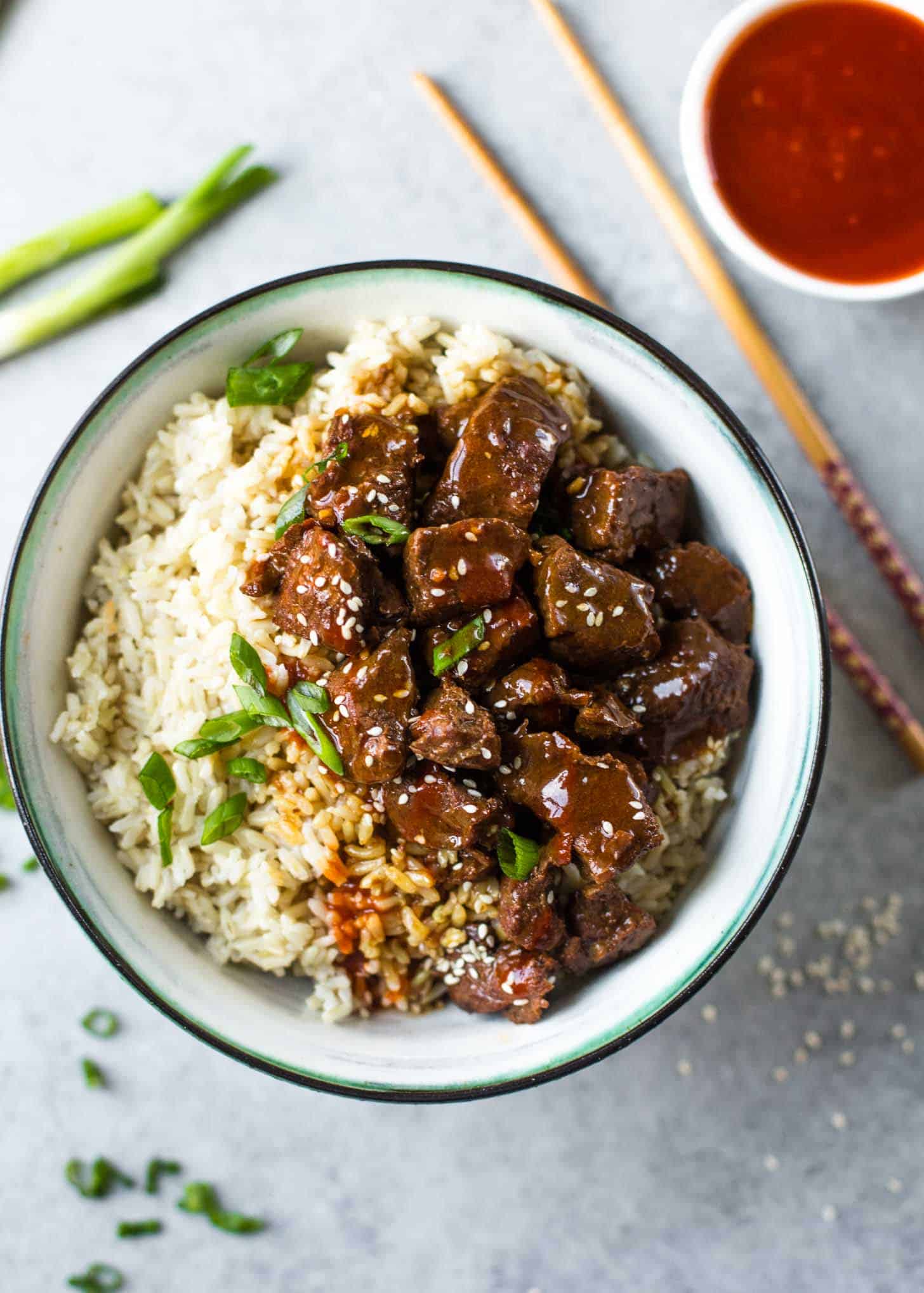 overhead image of Instant Pot Korean Beef and Brown Rice in a white bowl