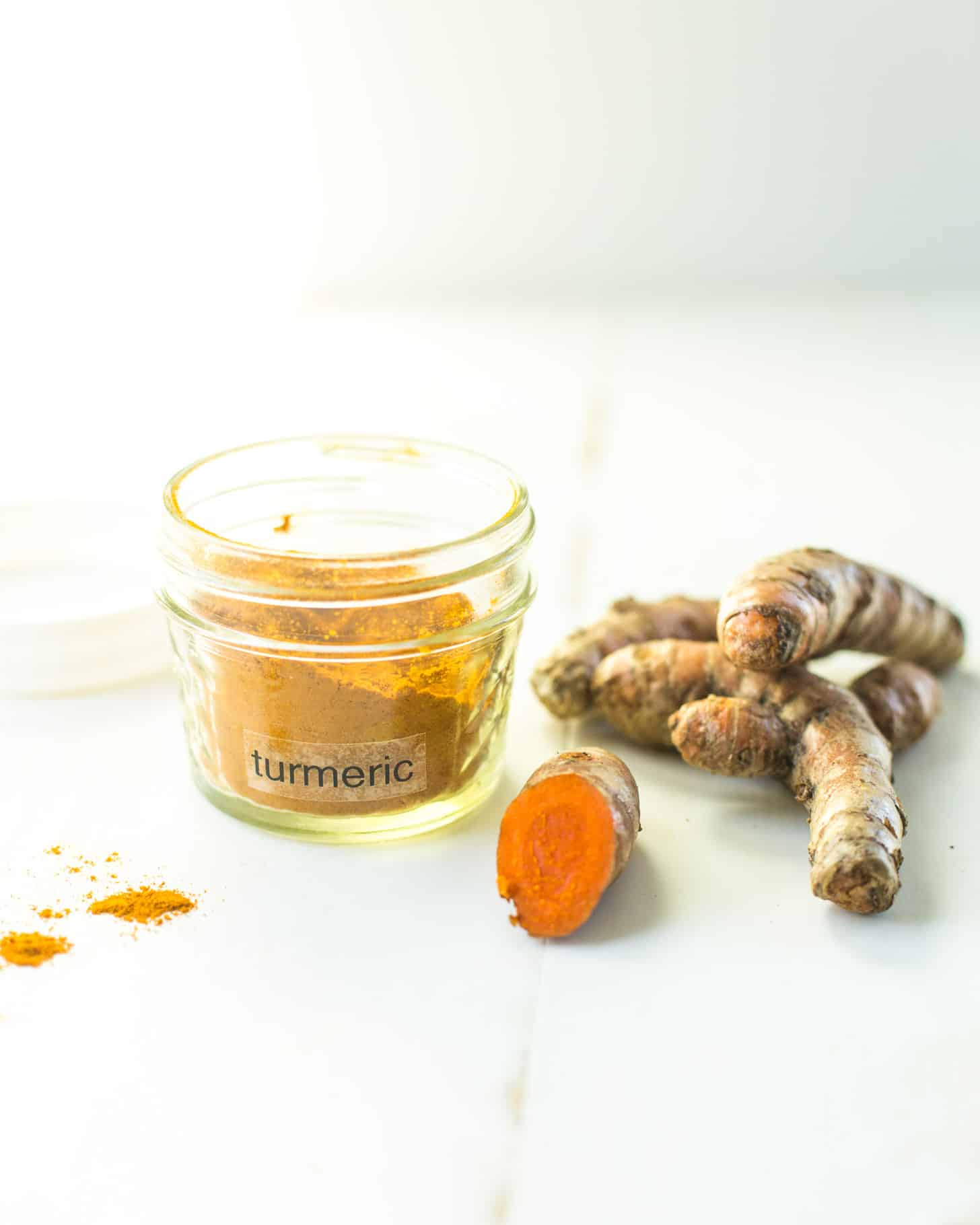 raw Turmeric on a white table