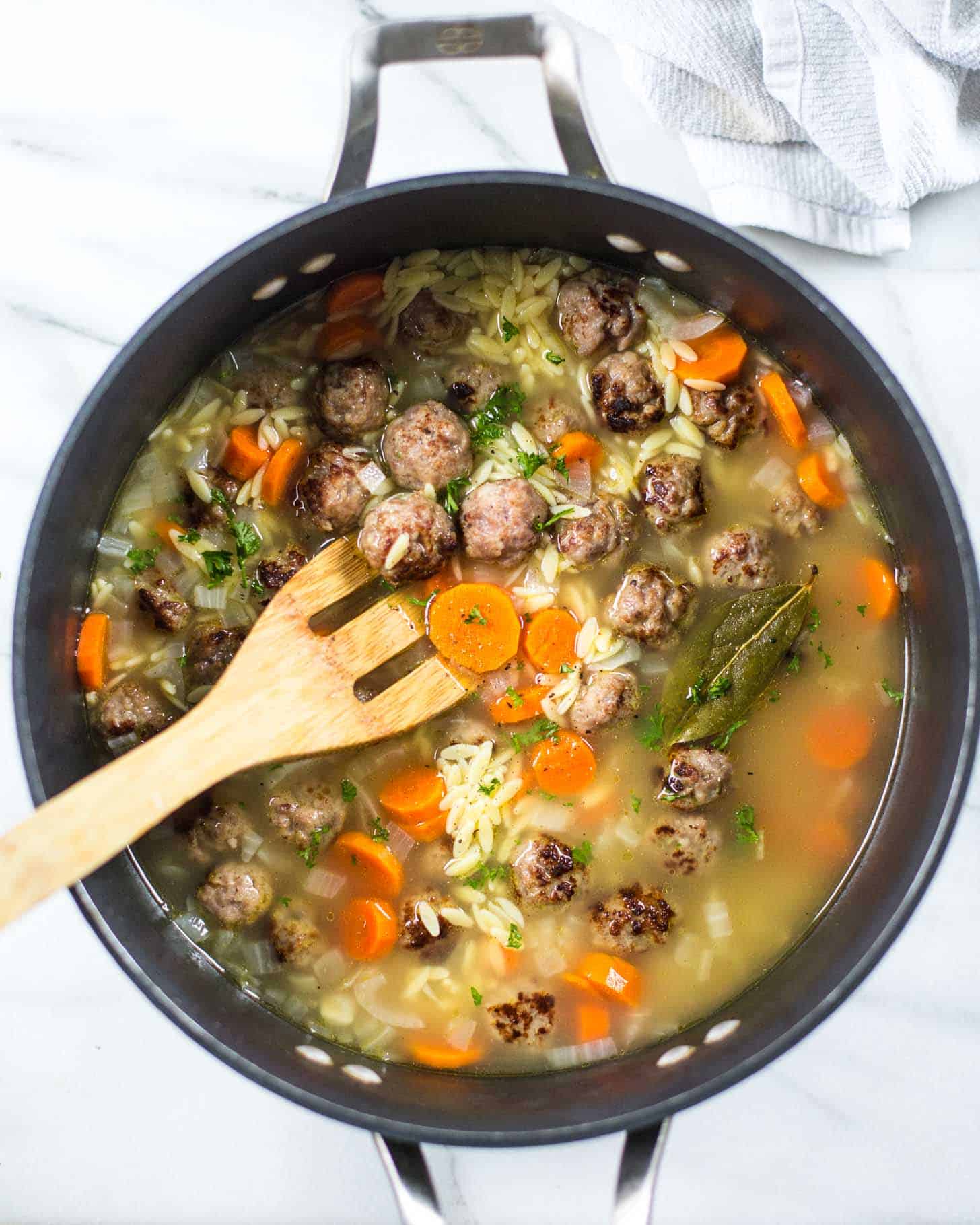 overhead image of Mini Italian Meatball and Orzo Soup in a large pot