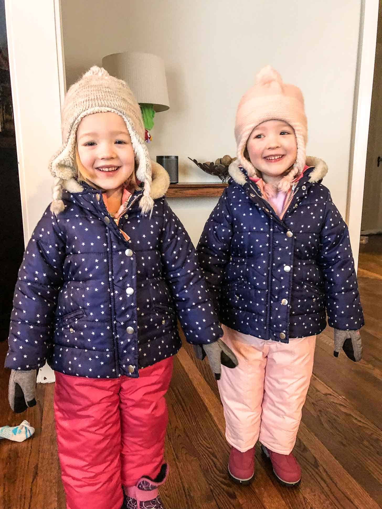 two little girls in snow gear