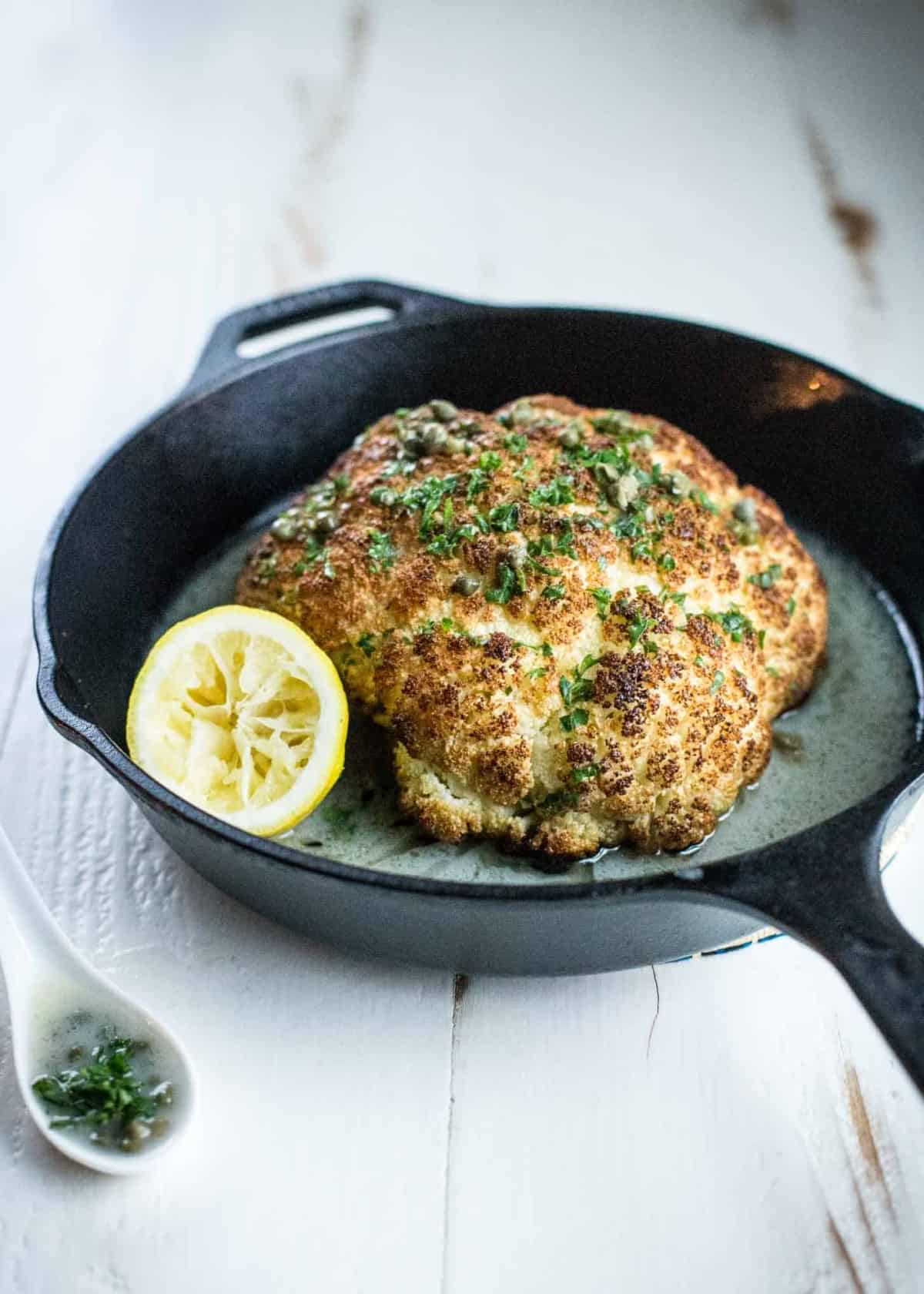 Whole Roasted Cauliflower in a skillet