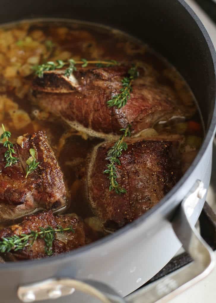 overhead image of short ribs in a dutch oven