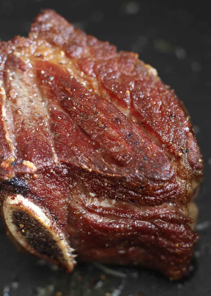 close up of a short rib in a dutch oven