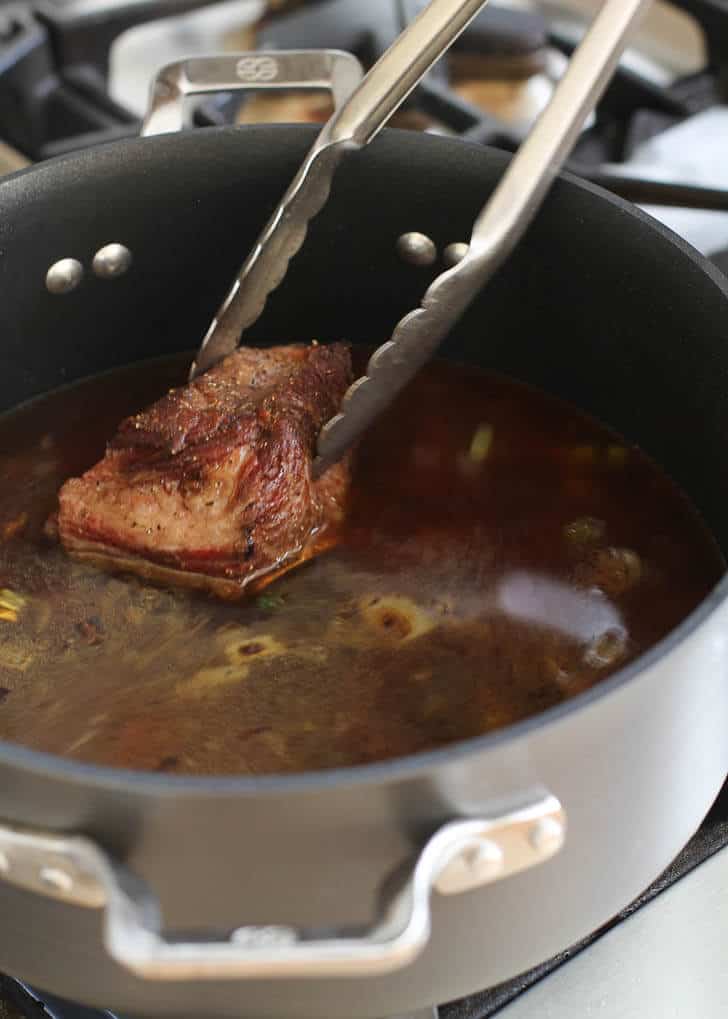 adding short ribs to stock in a dutch oven