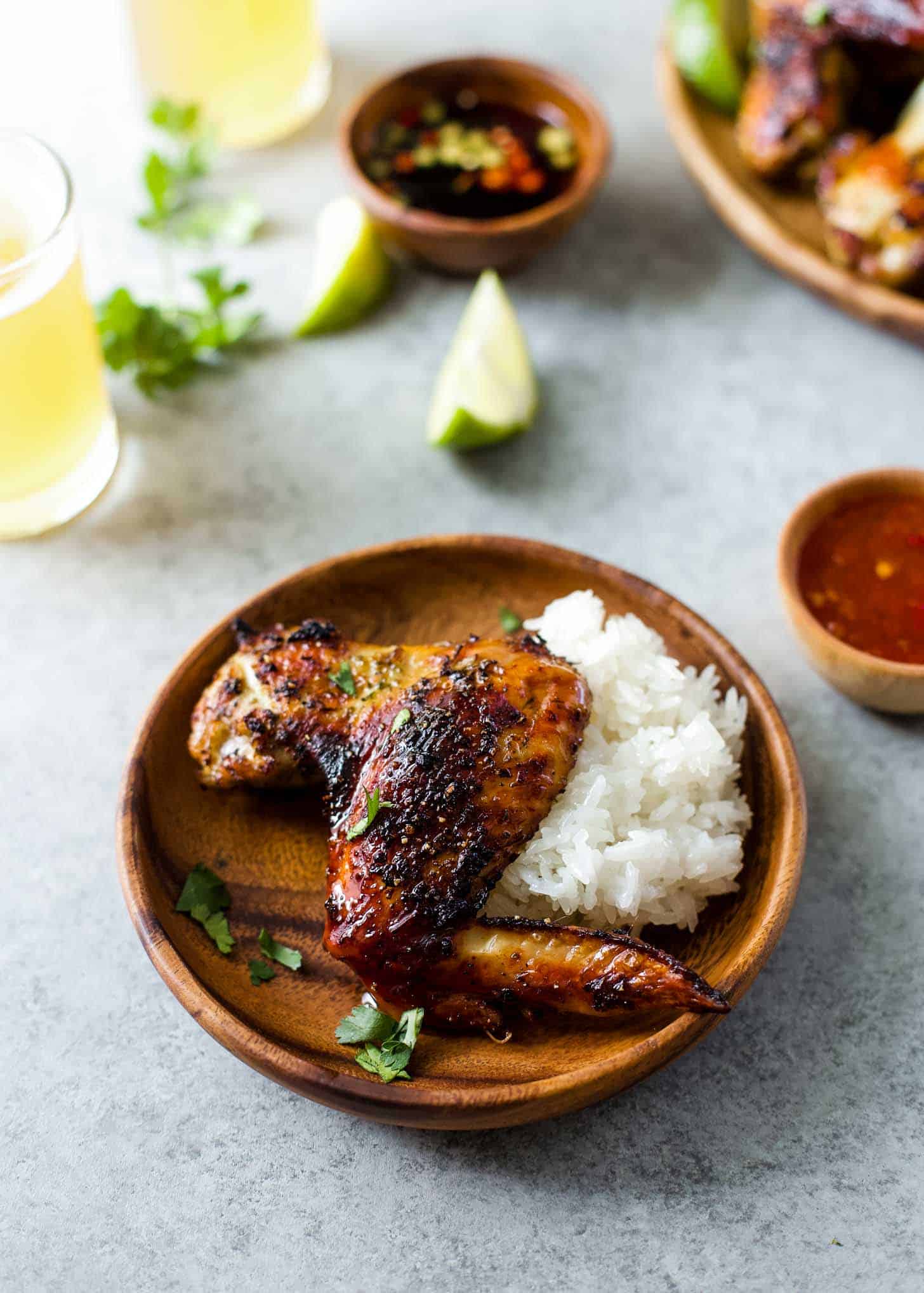 Thai Grilled Chicken (Gai Yang) with rice on a plate