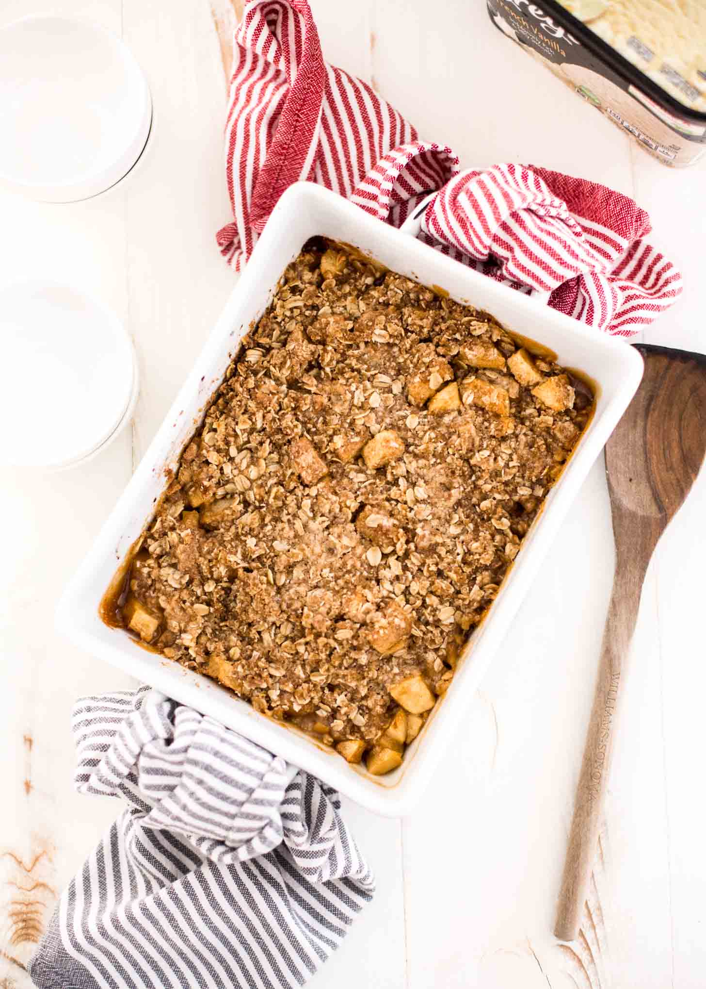 overhead image of apple Crumble in a white baking dish