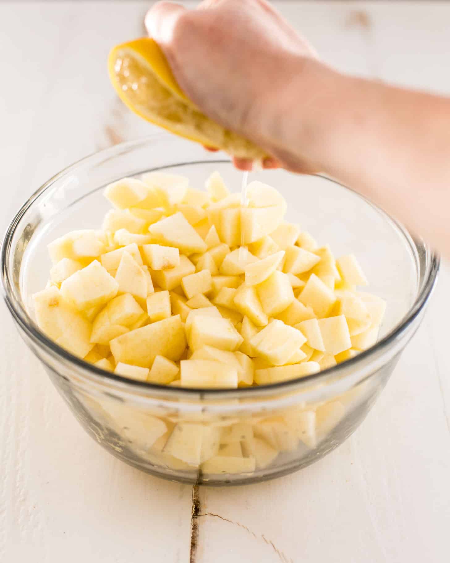 diced apples in a clear glass bowl