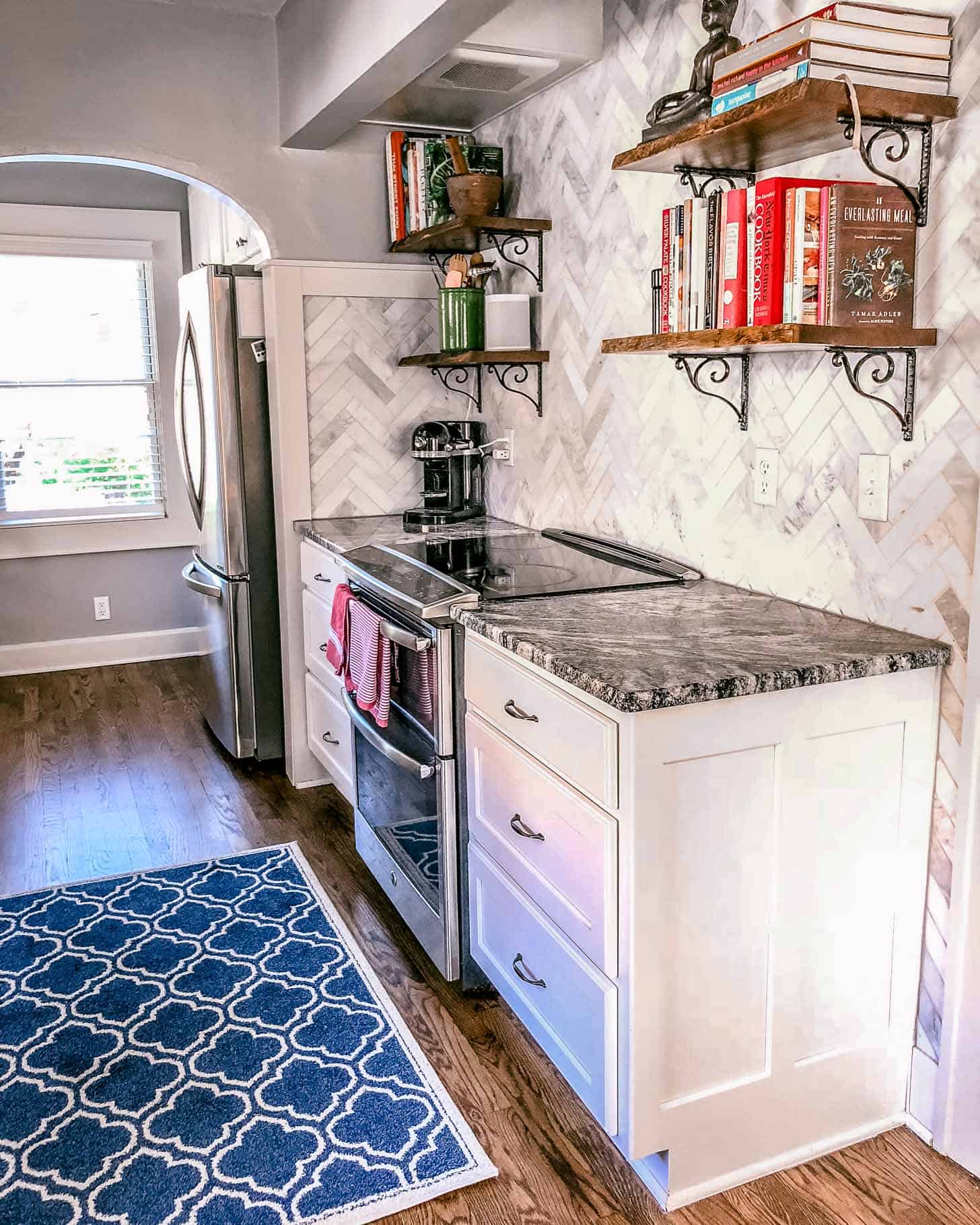 stove and cabinets in a white kitchen