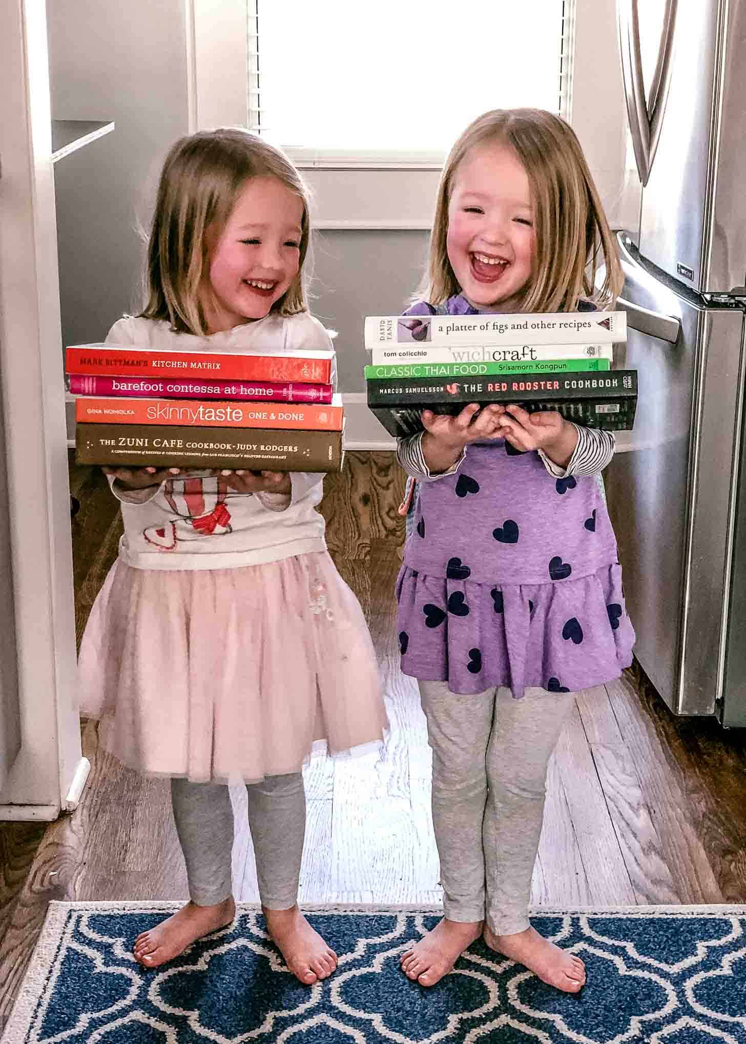 Molly and Clara holding cookbooks