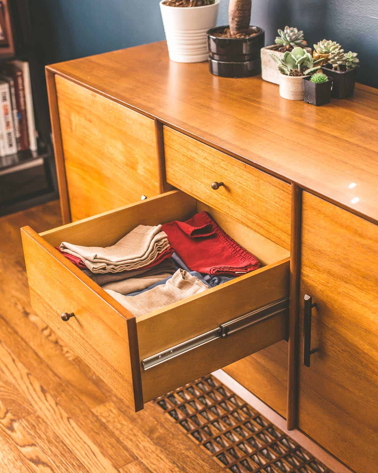 an open drawer with cloth napkins