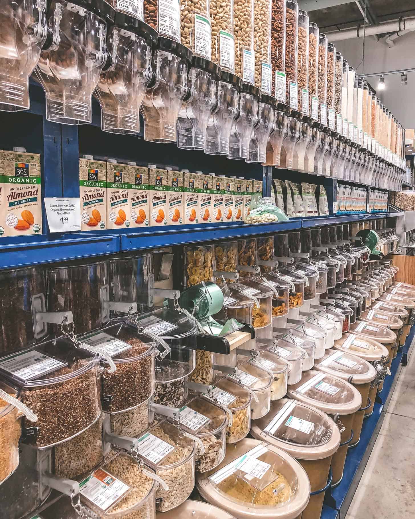 a line of bulk food items at whole foods