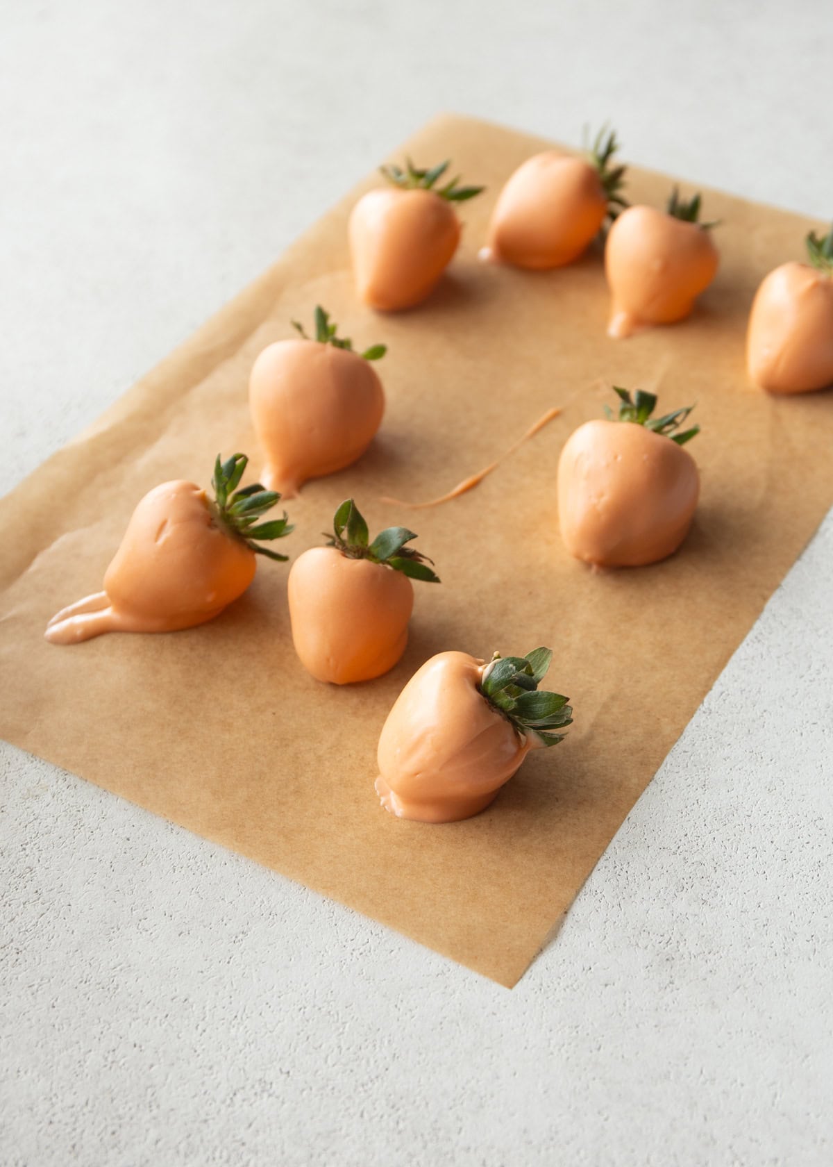 chocolate dipped strawberries on a piece of parchment paper
