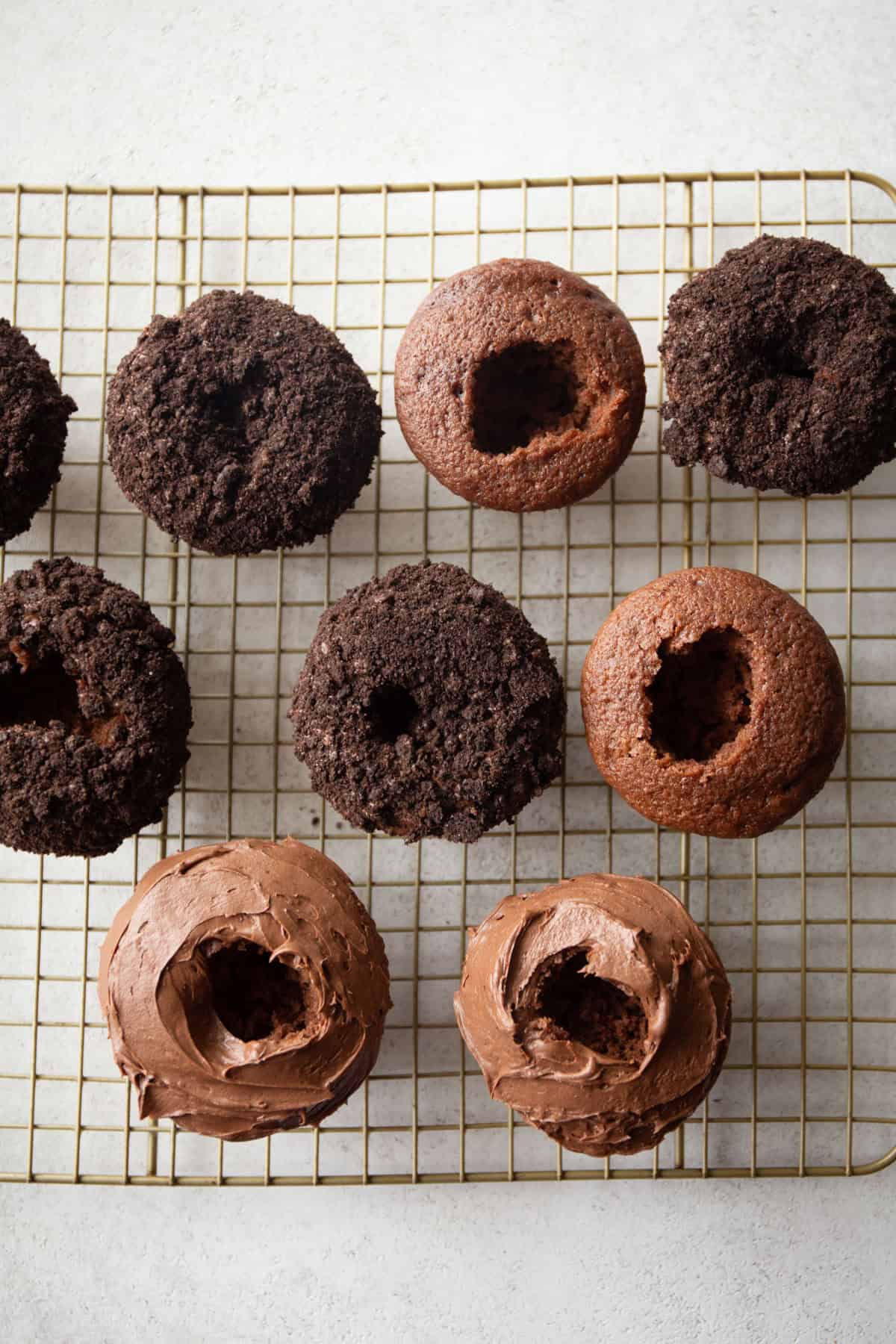 overhead image of chocolate cupcakes with a whole in the top