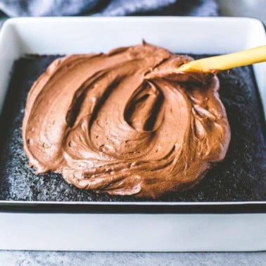 frosting a chocolate cake