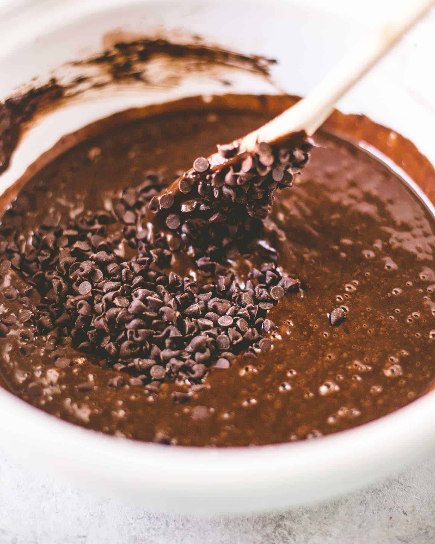 mixing chocolate chips into cake batter
