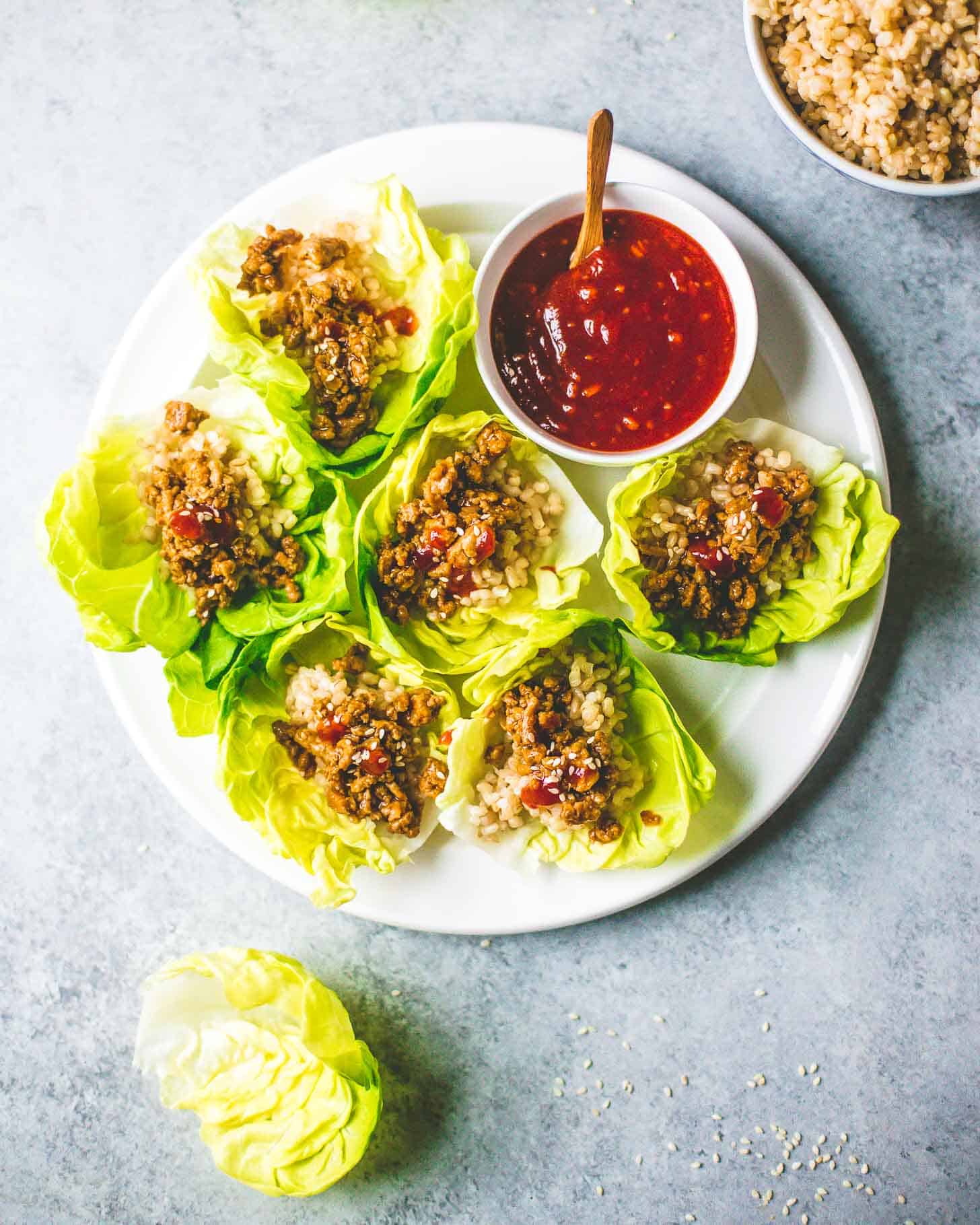 overhead image of Korean Chicken Lettuce Wraps on a white tray