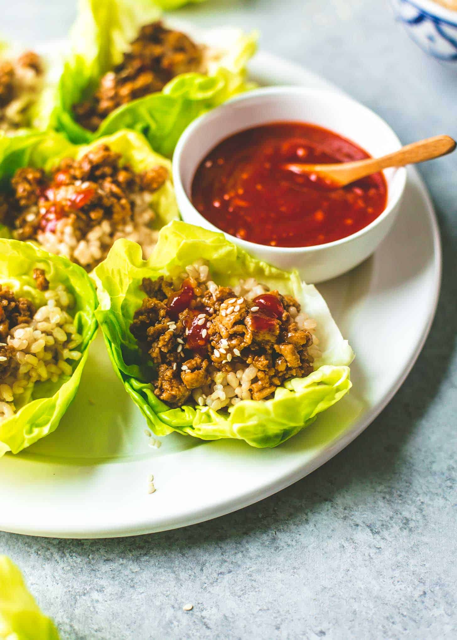 Korean Chicken Lettuce Wraps on a white plate