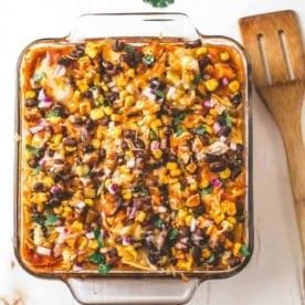 Chicken Enchilada Casserole in a clear baking dish