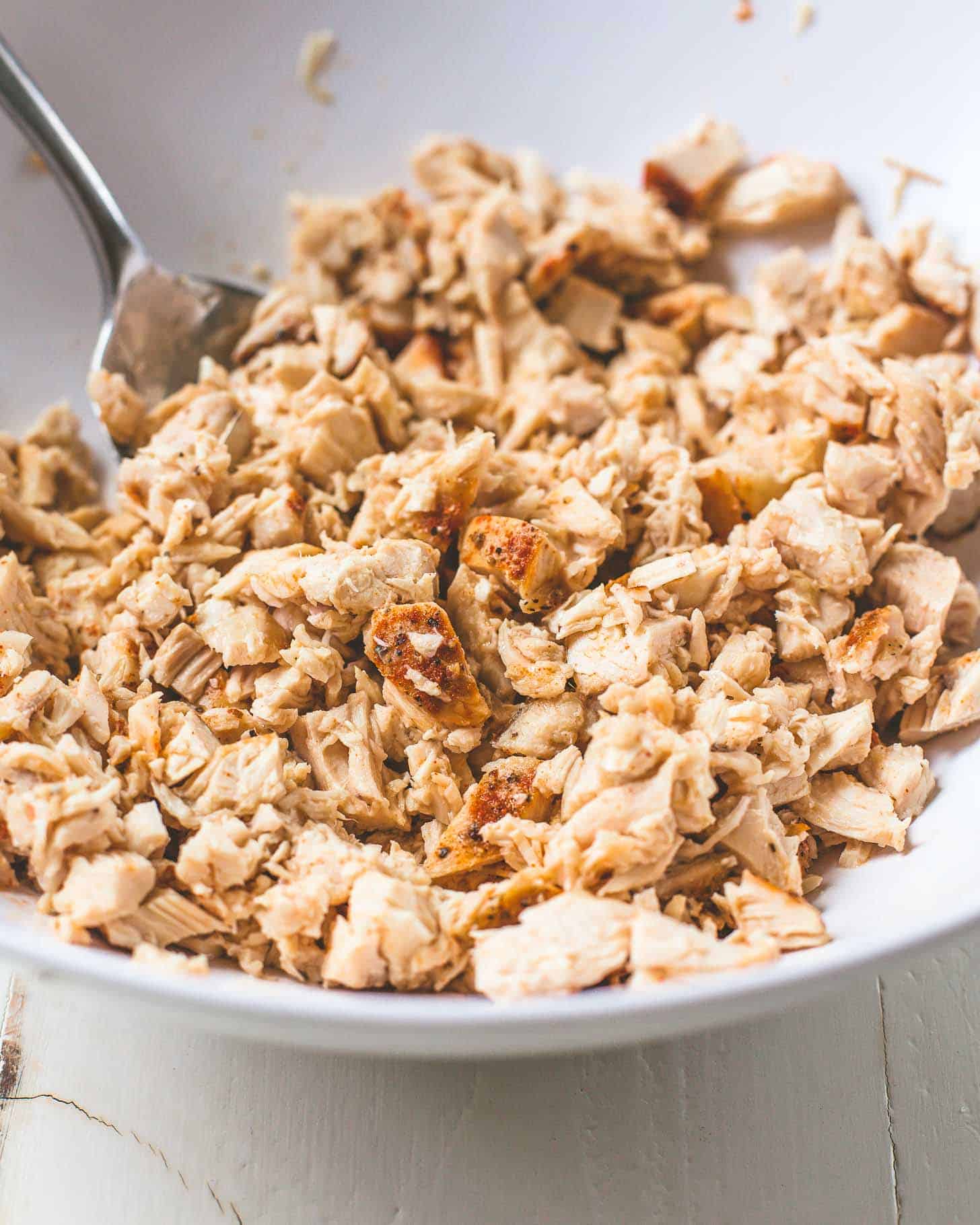 cooked chicken in a white bowl