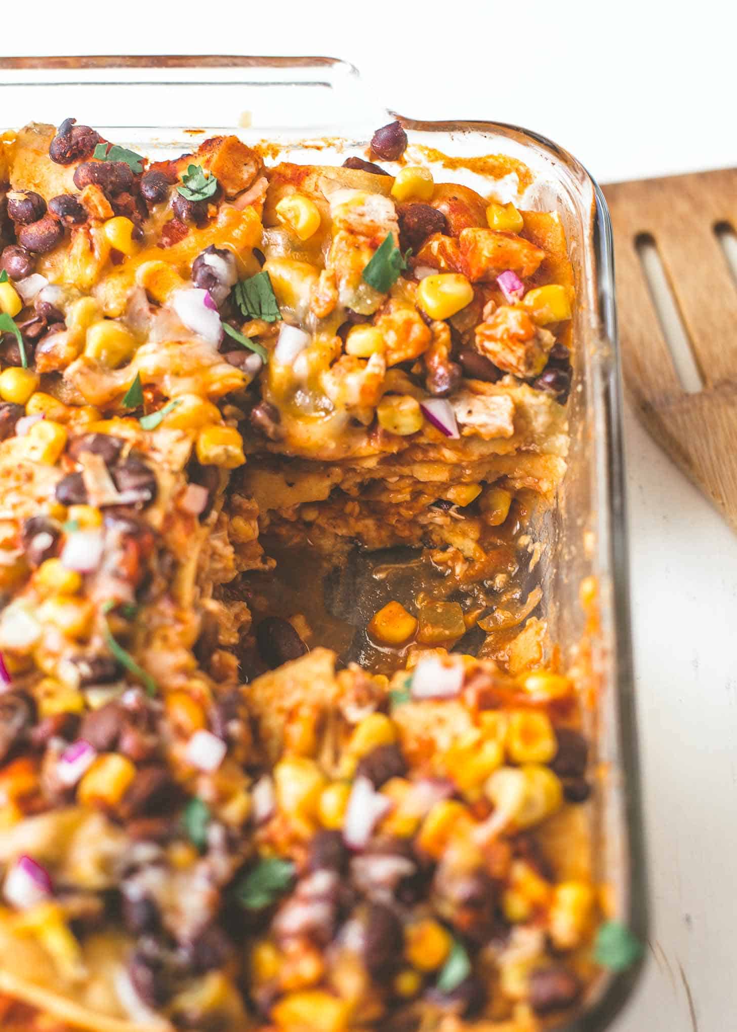 Chicken Enchilada Casserole in a clear baking dish