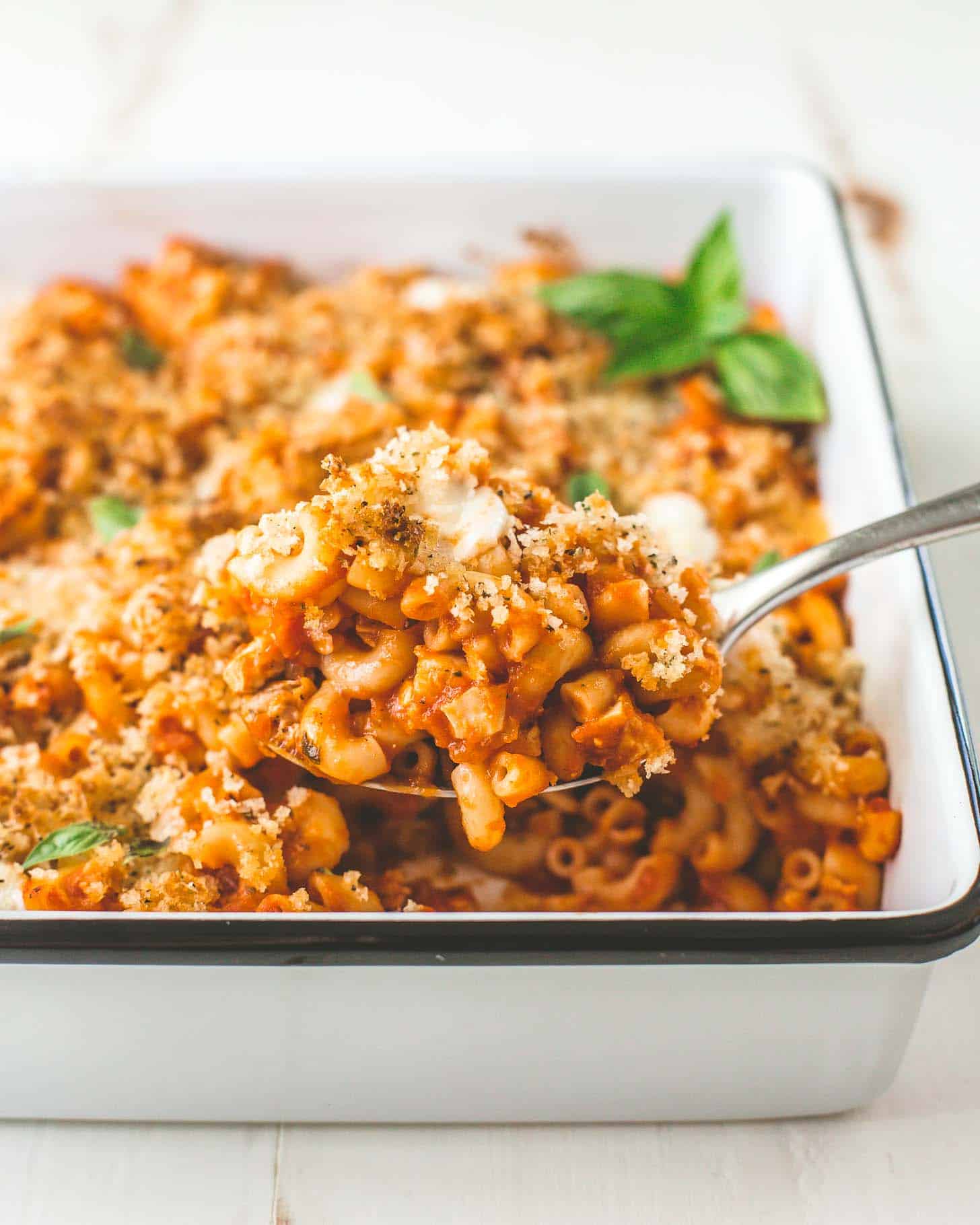 Pasta Bake in a white baking dish with a spoon