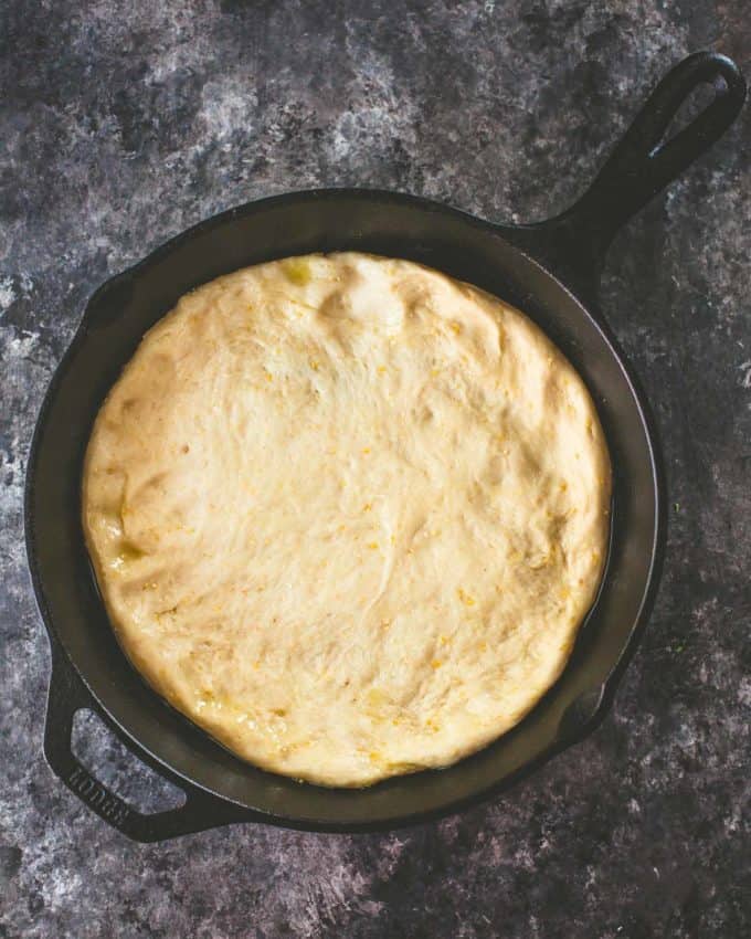 Deep Dish Pizza dough in a cast iron skillet